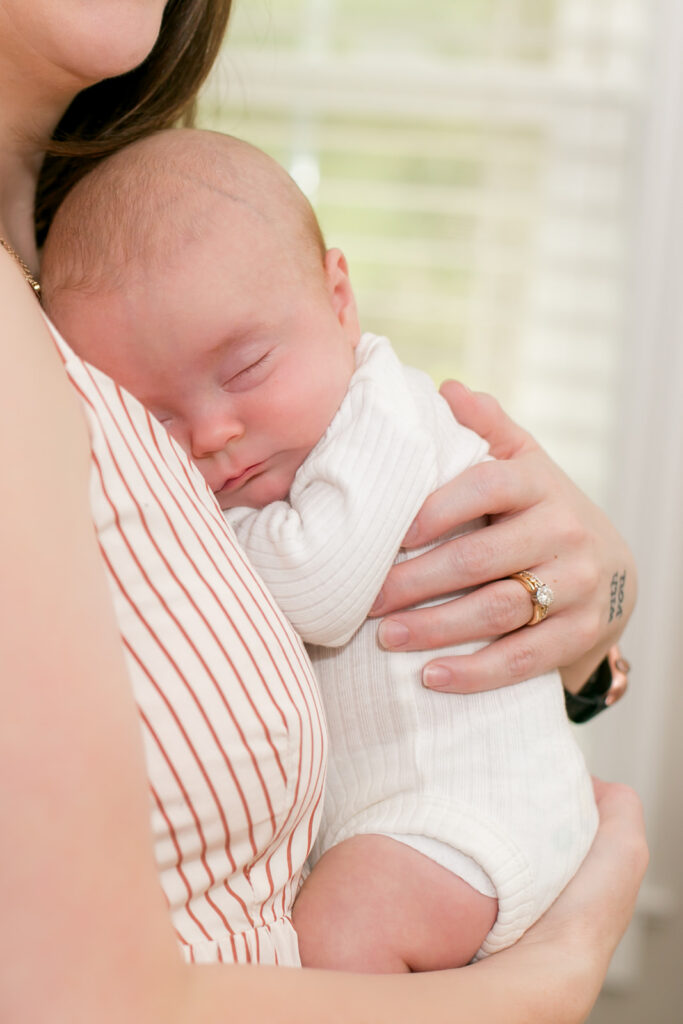 newborn baby resting on mom's chest at newborn photos in columbia sc