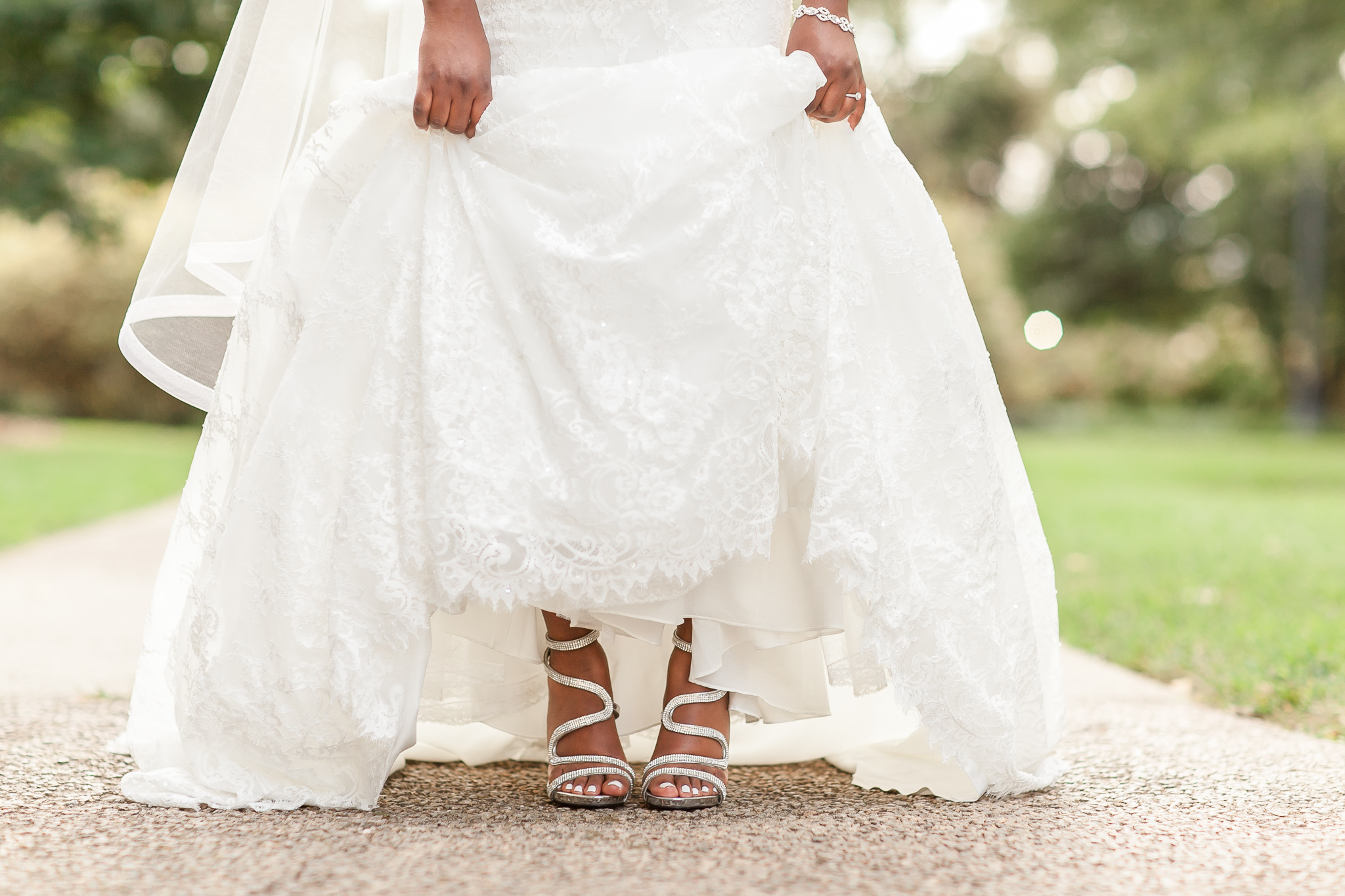 bride in wedding dress showing off wedding shoes at the South Carolina state house in Columbia, SC