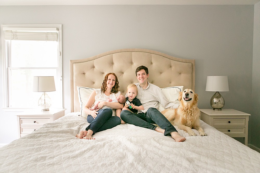 family posed on bed, using posing hack