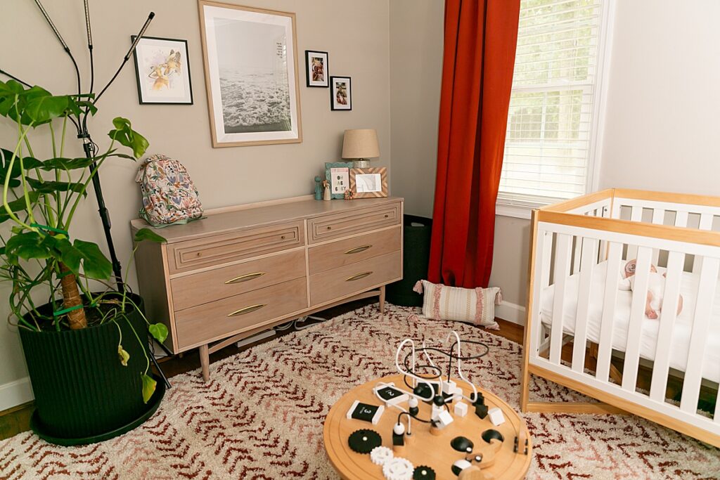  A cozy and organized Columbia, SC home with a decluttered living room and baby essentials prepared for a newborn's arrival.