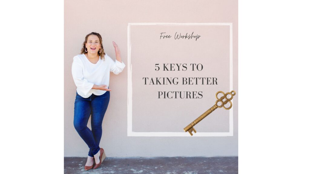 Emily Ann stands beside a sign that says Free Workshop 5 Keys to Taking Better Pictures, a skeleton key beneath the words