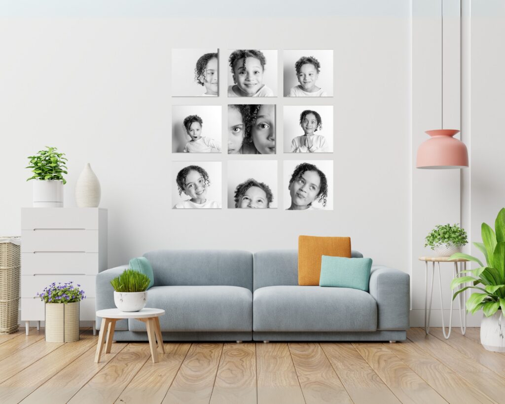 Framed grid of black and white child personality portraits displayed as wall art in a modern home